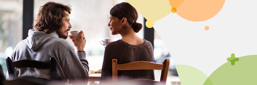 back view of couple in a restaurant chatting with each other