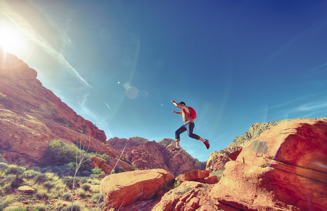 Person jumping in the desert