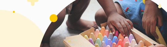 box with colored chalk pencils