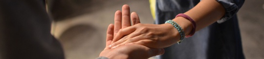 Two people holding hands